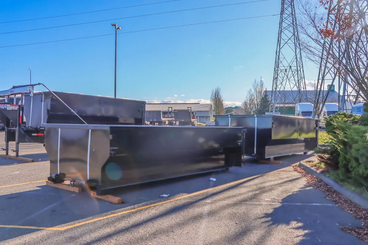 Roll-off dumpster ready for waste disposal at job site for 2 Yard Dumpster Rental in Naranja